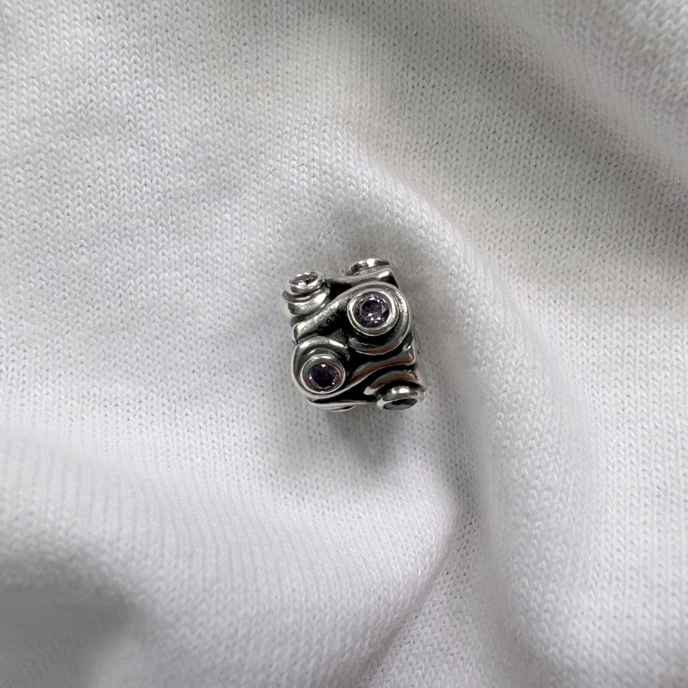 Authentic pandora 925 silver threaded core charm with crystal accents.